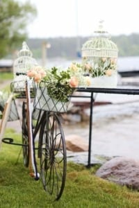 bicycle with flowers in the basket at MN lakeside wedding