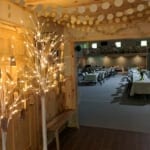 Brainerd Lakes Area resort wedding venue foyer decorated with with tree lights