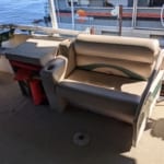 Pontoon rental boat with a bench seat and 5 bucket seats on Fish Trap Lake