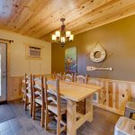 Rustic wooden lakeside dining room of 2br lakeside rental