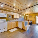 Kitchen with Oven, Refrigerator, Microwave, Dishwasher, and Pine Cabinets
