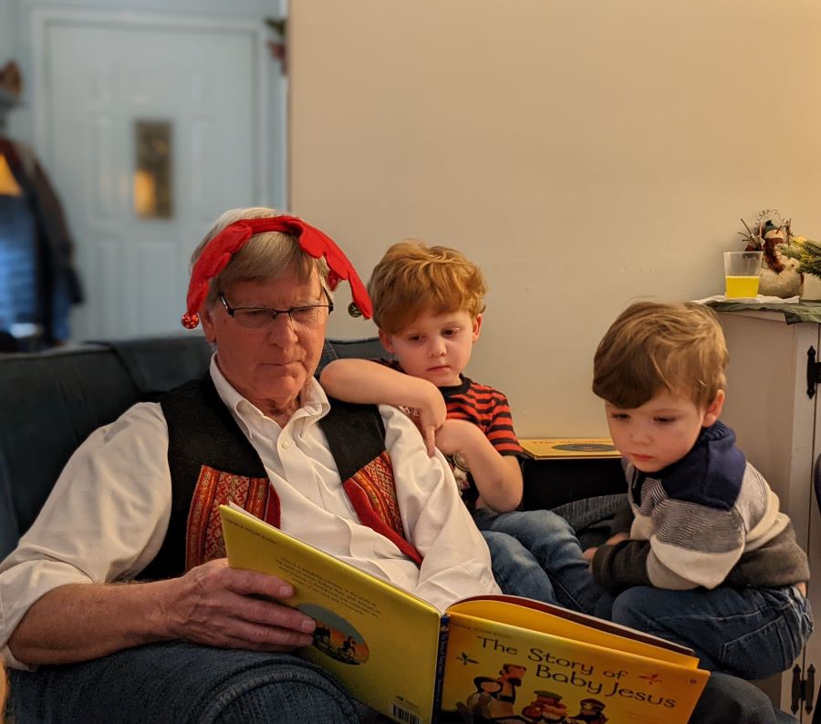 Grandpa reading the Christmas story is a great holiday tradition