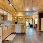 Pine Wood Kitchen Complete with Oven, Microwave, Dishwasher, and Refrigerator
