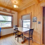 Cozy kitchenette near windows and view of fishtrap lake
