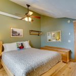 Third floor queen size bedroom. Pine hardwood floors and angle ceiling with ceiling fan.