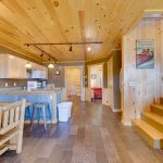 Open concept kitchen and dining room on main floor of 2br lakeside cabin rental