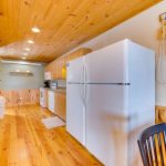 Large spacious kitchen with two refrigerators, full size range, microwave, and dishwasher
