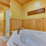 Full Bath with Whirlpool Tub and Heated Tile Floor in Tri Level Cabin