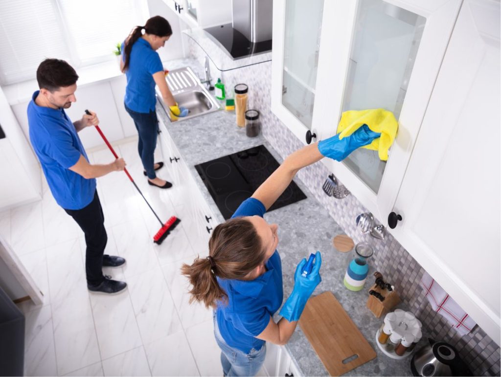 A cleaning crew cleans a kitchen. House cleaning is a great gift for acts of service love language