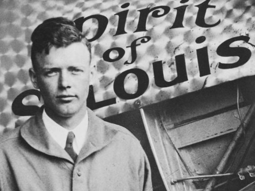 black and white photo of Charles Lindbergh Museum by Spirit of St. Louis plane