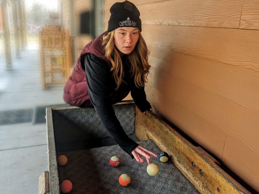 Activities at a lake resort such as carpetball are great things to do on vacation.