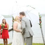 A MN lakeside wedding near Little Falls in the rain is fine with clear umbrellas!