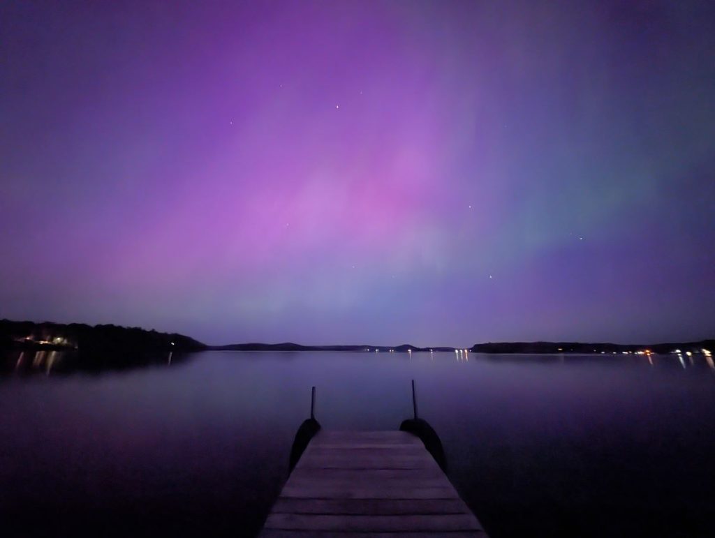 A beautiful night at Campfire Bay Resort in northern MN with an aurora borealis over a dock