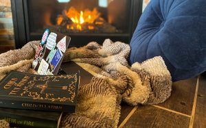 A snuggly blanket near a warm fire in a lakeside cabin at Campfire Bay Resort, MN