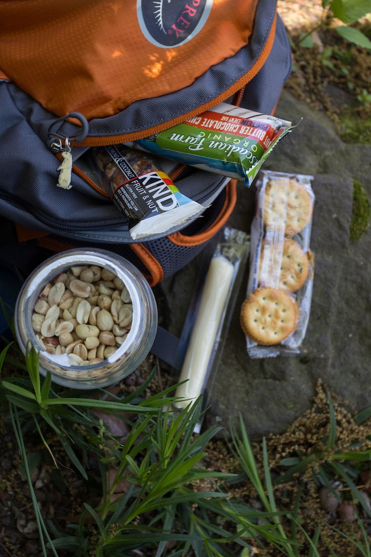 a backpack and all the food in it--nuts, bars, crackers, and string cheese