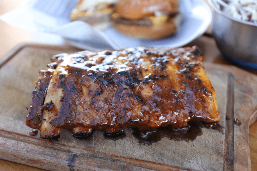 A cut of ribs on a serving board.