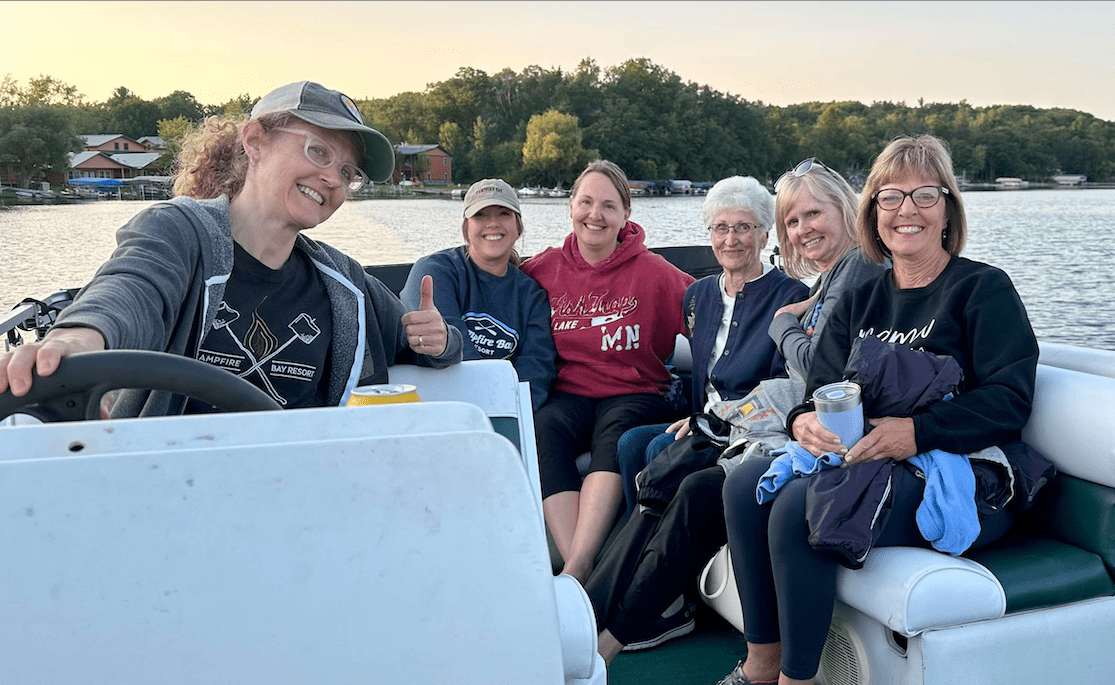 A group of ladies enjoy a nice sunset pontoon cruise.