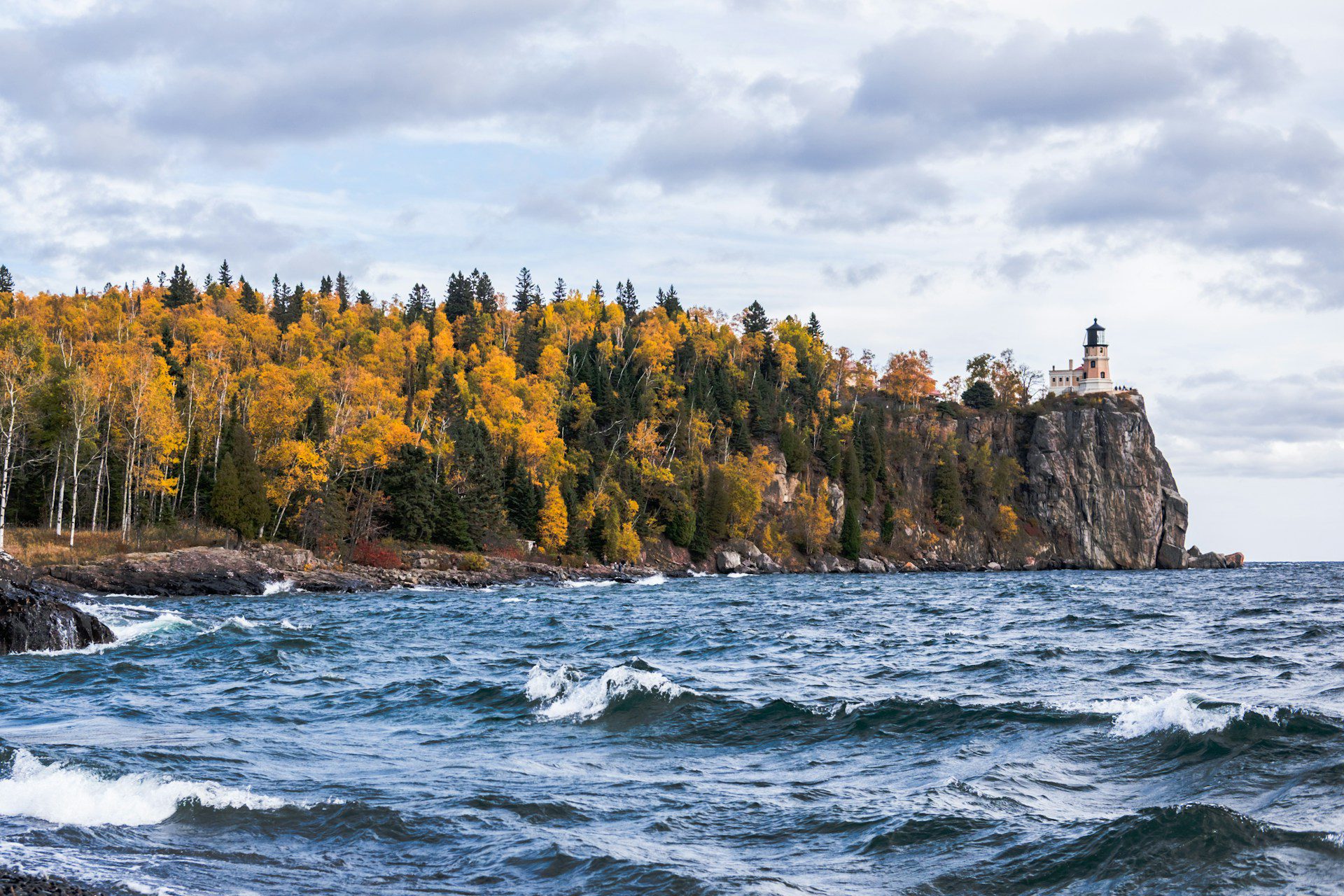 Image of Minnesota's North Shore in the fall, a lighthouse can be seen