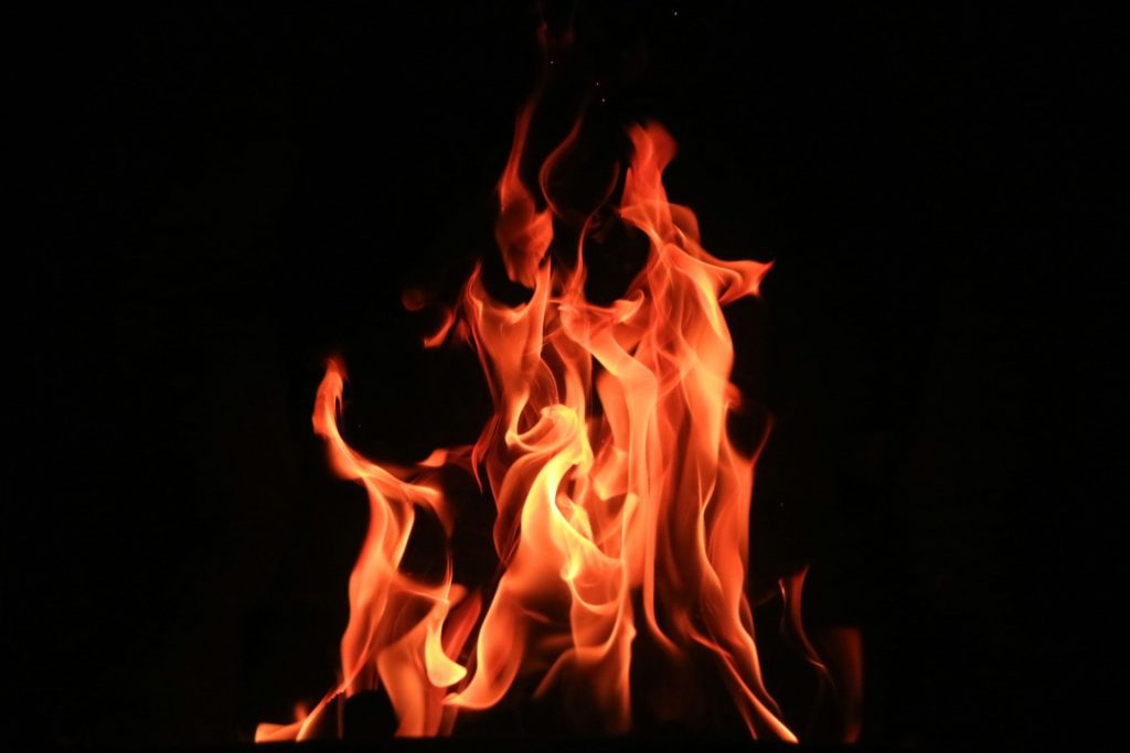 Fire burning against a black background
