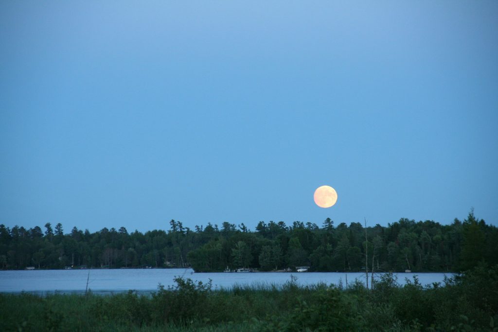 Bright moon over a lake