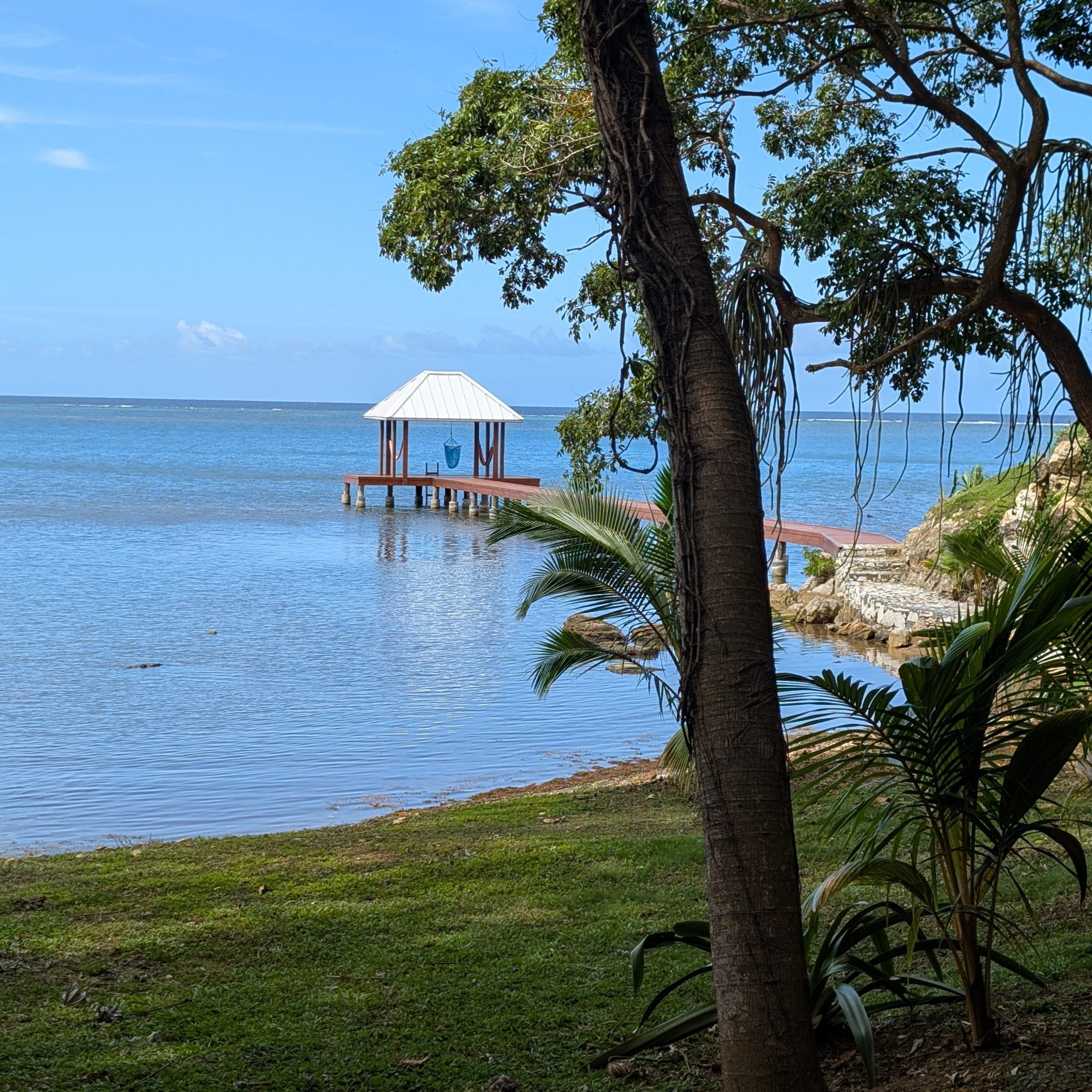 Dock with covered deck area on the Caribbean Sea on Roatan, Honduras