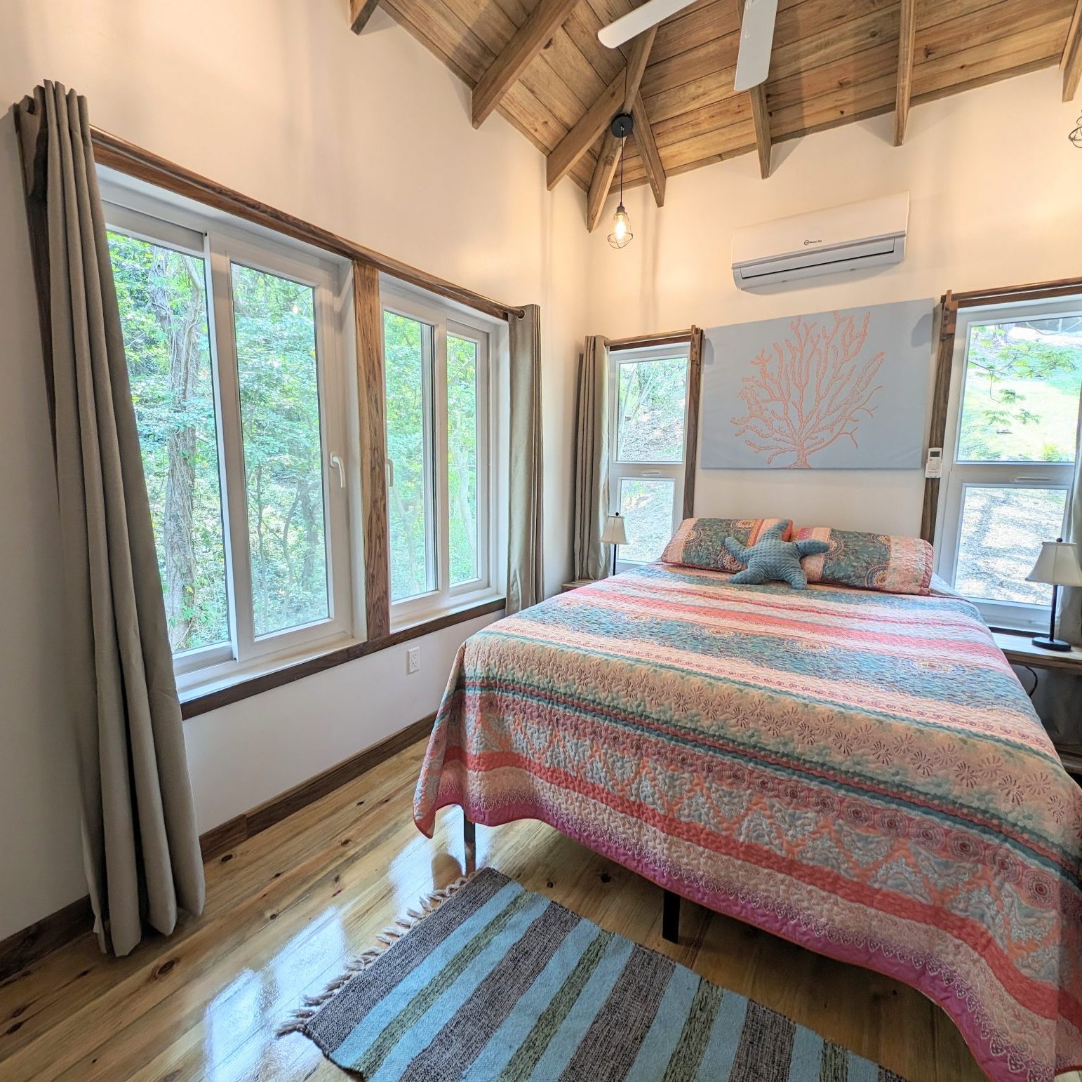 Jungle side bedroom of beach rental home has lush forest views
