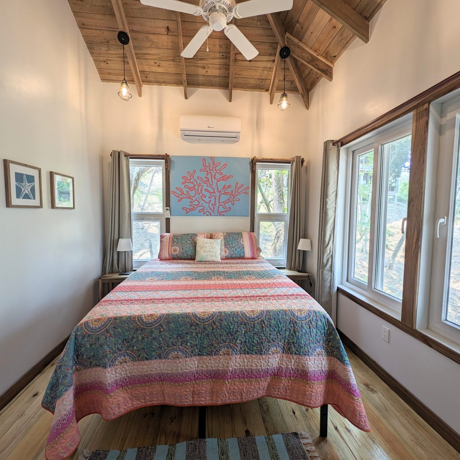Roatan Honduras ocean access 2br cabin bedroom with queen bed and sea view